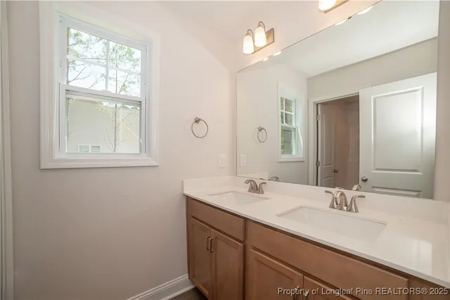 a bathroom with a sink a vanity and a mirror