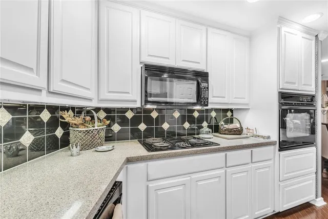 a workspace with lots of furniture and wooden floor