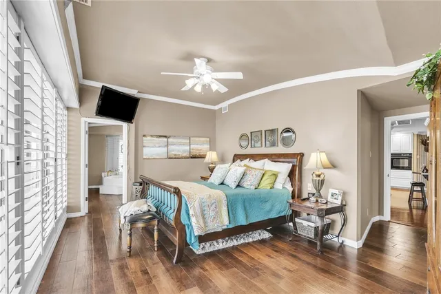 a large bed sitting next to a window