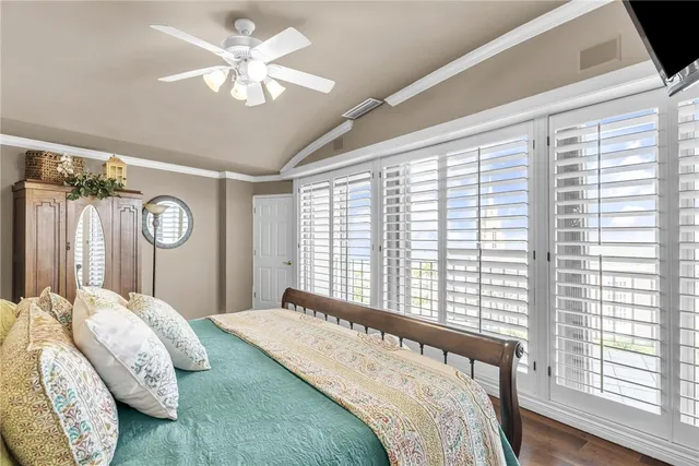 a spacious bathroom with a tub shower and mirror