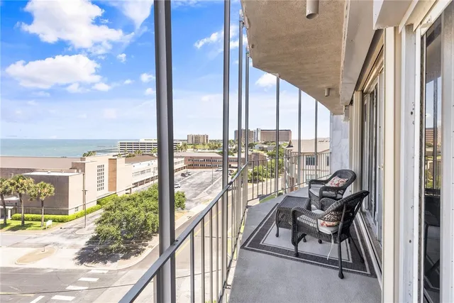 a view of a swimming pool with a lounge chairs