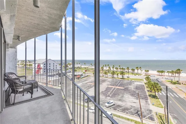 a view of a balcony with an ocean view