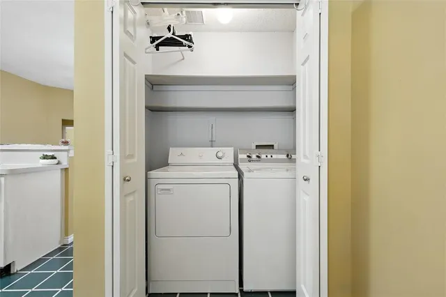 a utility room with dryer and washer