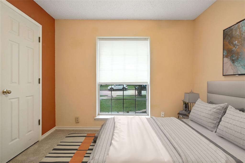 4609 Hunters Ridge Drive Sachse, TX 75048 - Photo 31 of 38 a bedroom with a bed and a window