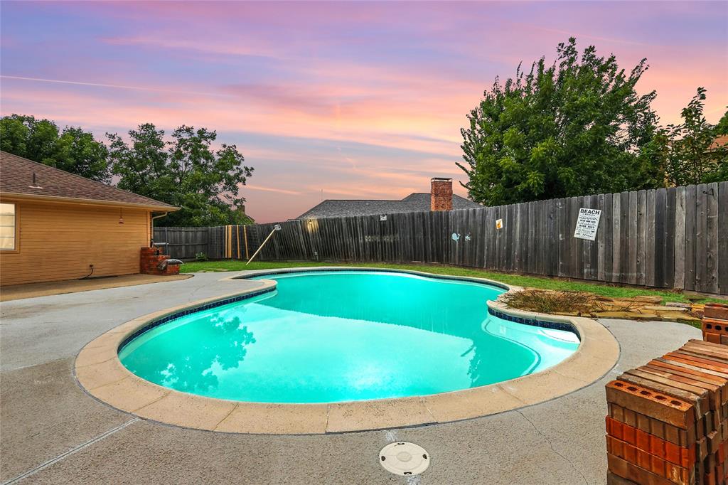 4609 Hunters Ridge Drive Sachse, TX 75048 - Photo 33 of 38 a view of swimming pool with a yard