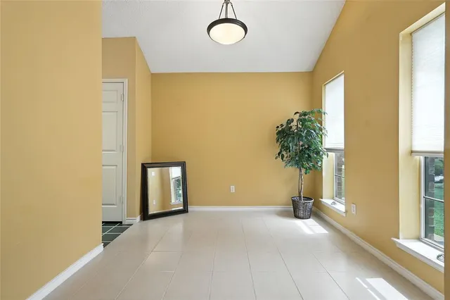 a view of a room with a potted plant