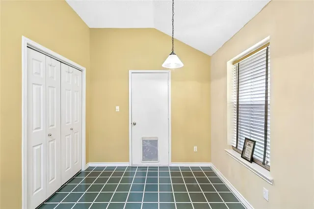 a bathroom with a glass door shower