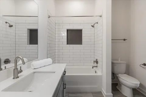 a bathroom with a granite countertop sink mirror and double