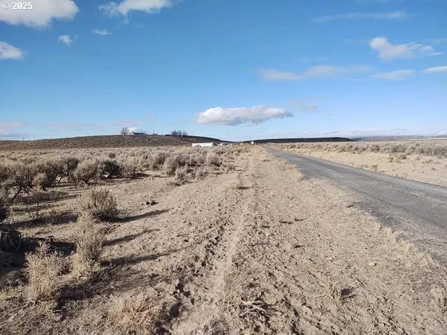 a view of walk in closet with clothes
