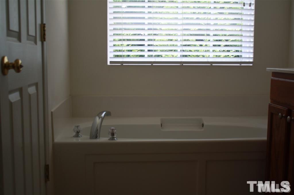114 Graystar Road Apex, NC 27502 - Photo 7 of 8 ensuite master bath has garden tub & separate shower..