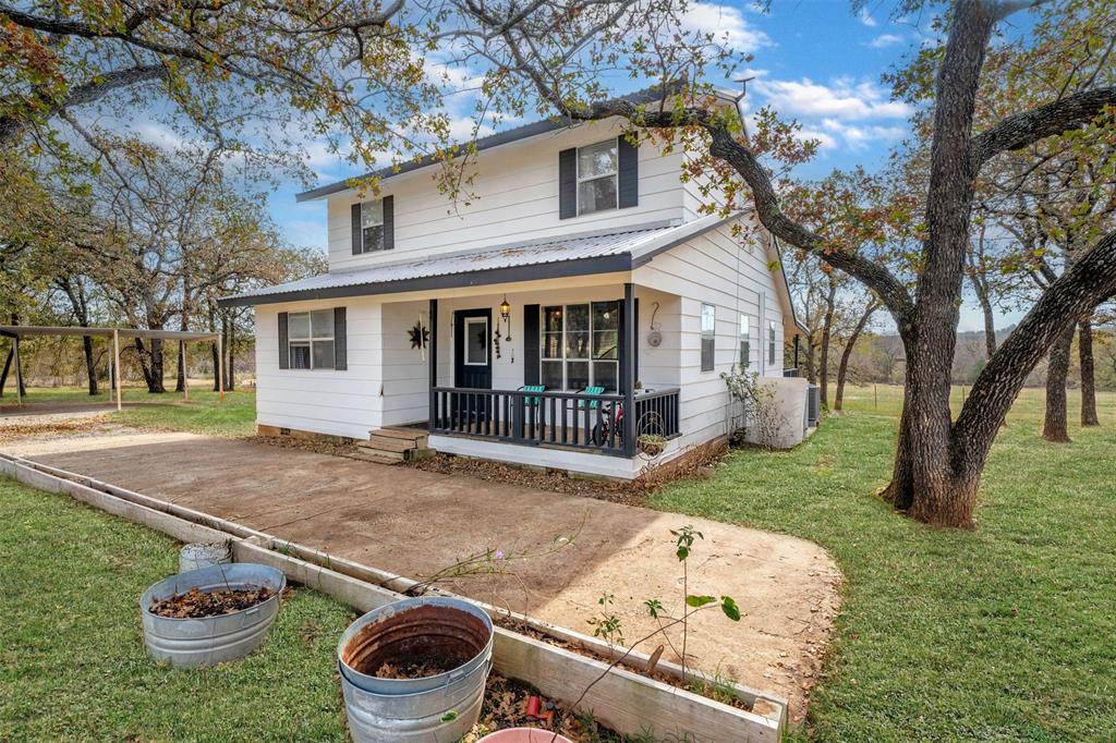 218 Private Road 3638 Springtown, TX 76082 - Photo 1 of 1 a backyard of a house with yard and outdoor seating