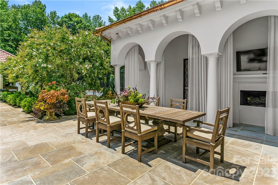 8371 Providence Road Charlotte, NC 28277 - Photo 14 of 48 a view of a dinning table and chairs in patio