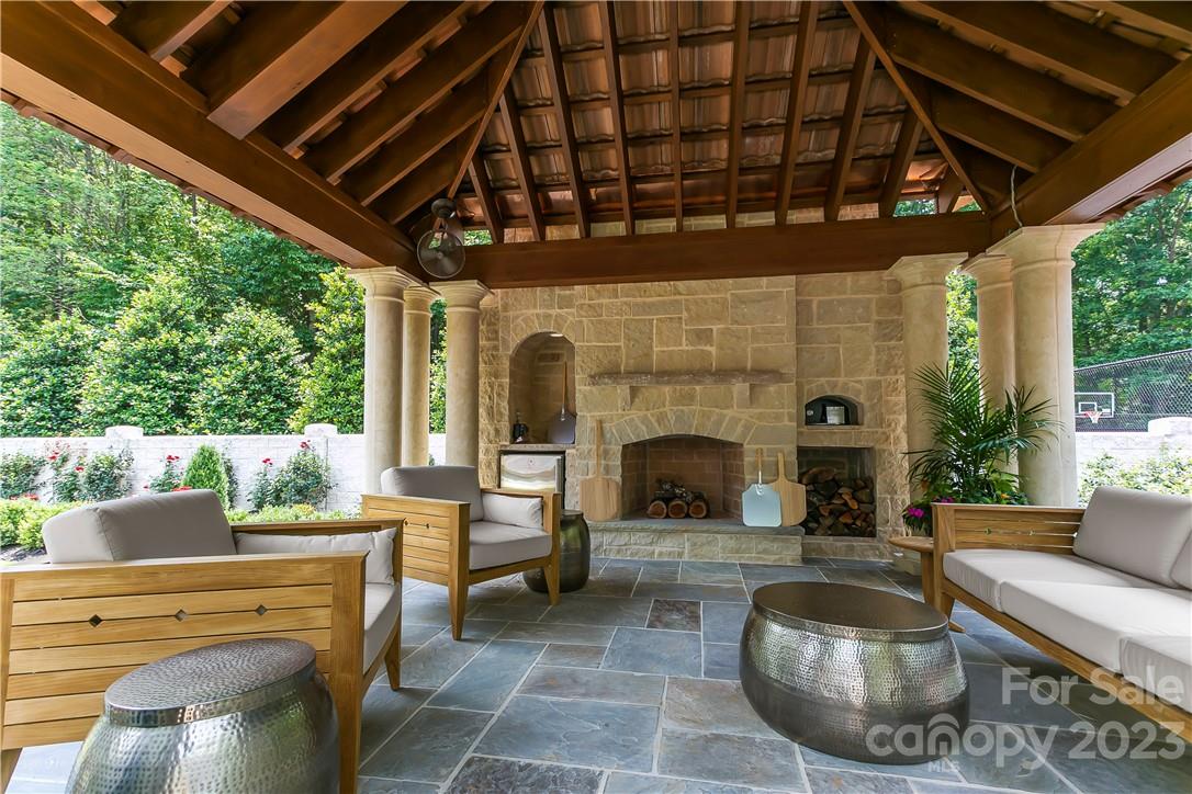 8371 Providence Road Charlotte, NC 28277 - Photo 15 of 48 a outdoor space with patio fireplace and furniture