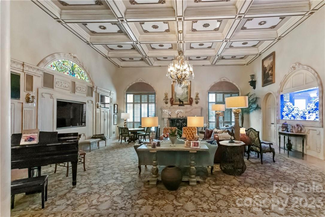 8371 Providence Road Charlotte, NC 28277 - Photo 20 of 48 a living room with lots of furniture and a chandelier