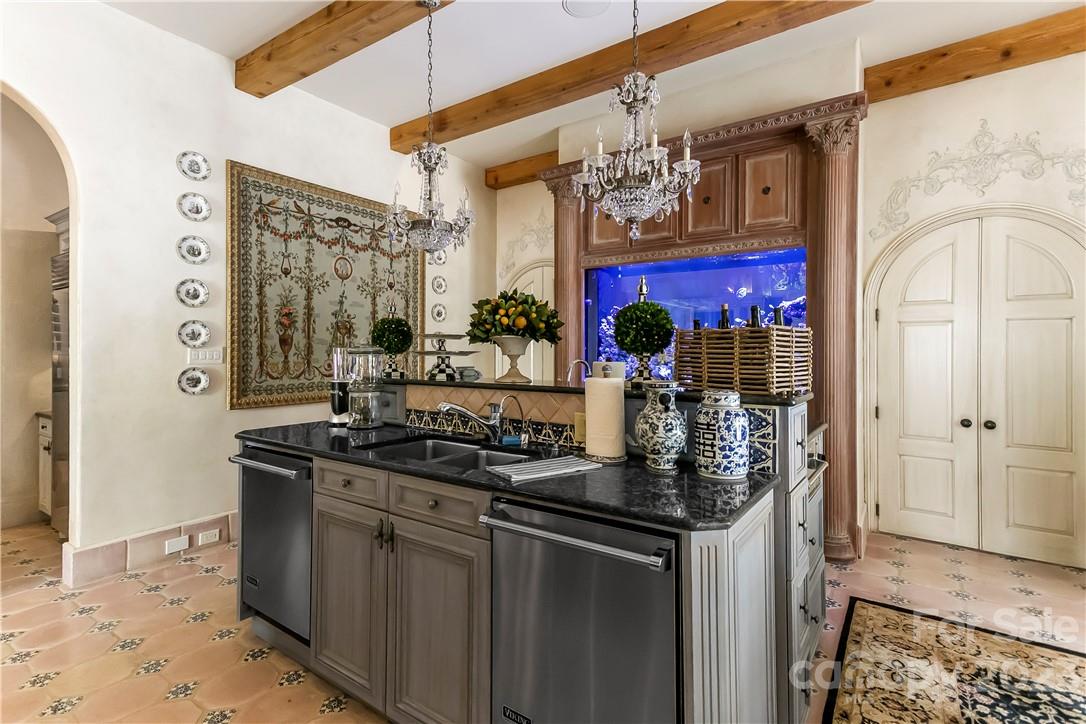 8371 Providence Road Charlotte, NC 28277 - Photo 27 of 48 a kitchen with stainless steel appliances granite countertop a sink and cabinets
