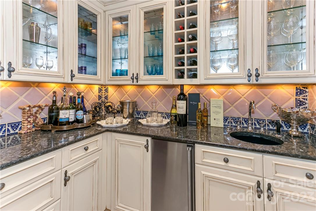 8371 Providence Road Charlotte, NC 28277 - Photo 31 of 48 a kitchen with granite countertop a sink and a window