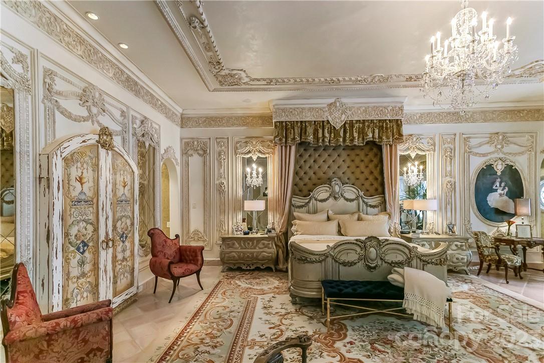 8371 Providence Road Charlotte, NC 28277 - Photo 34 of 48 a living room with furniture chandelier and a fireplace