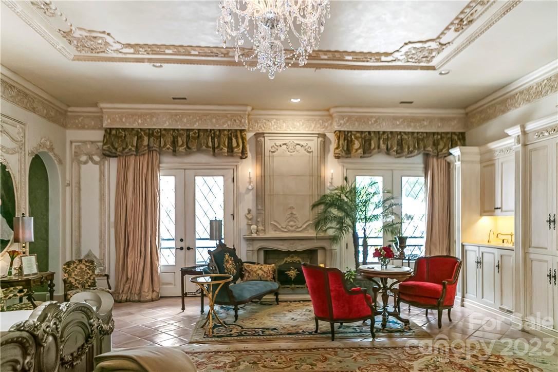 8371 Providence Road Charlotte, NC 28277 - Photo 35 of 48 a living room with furniture and a chandelier