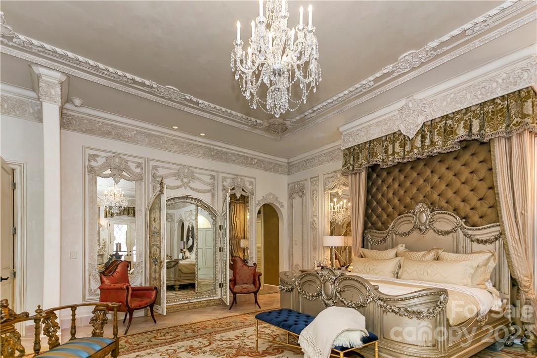 8371 Providence Road Charlotte, NC 28277 - Photo 36 of 48 a living room with furniture and a chandelier