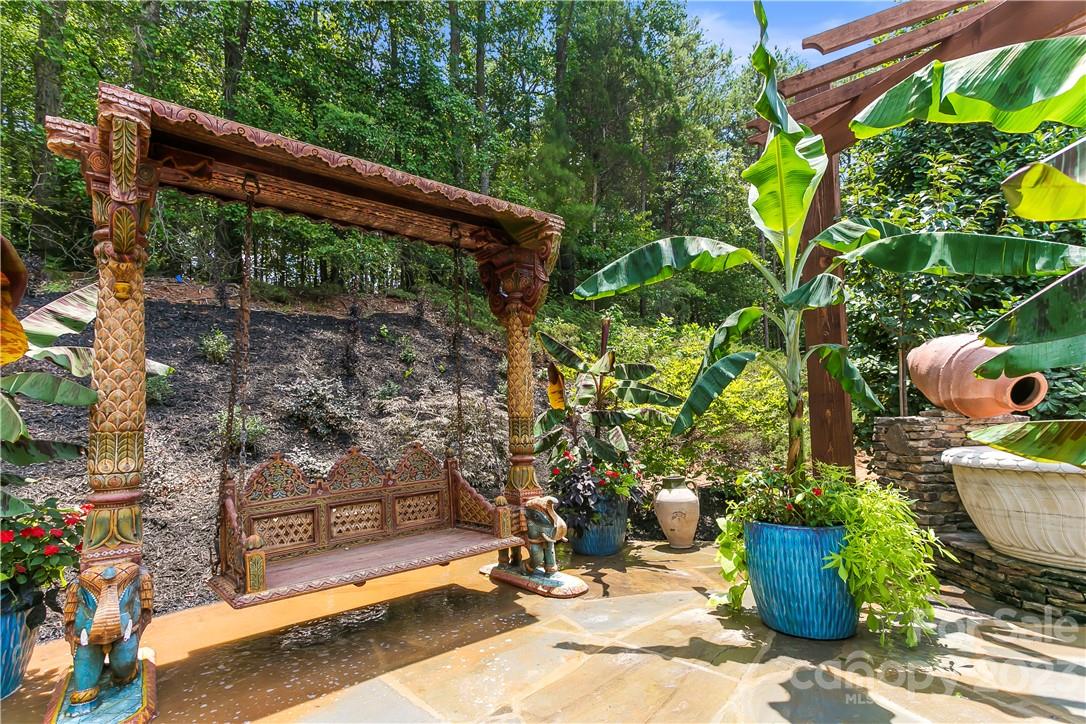 8371 Providence Road Charlotte, NC 28277 - Photo 40 of 48 a backyard of a house with outdoor seating