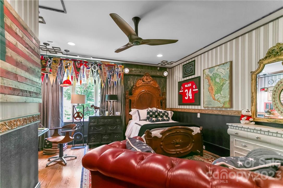 8371 Providence Road Charlotte, NC 28277 - Photo 44 of 48 a living room with furniture a fireplace and a flat screen tv
