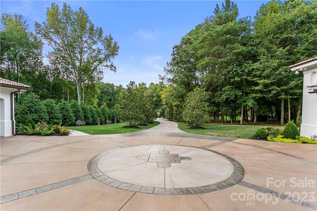 8371 Providence Road Charlotte, NC 28277 - Photo 9 of 48 a view of a swimming pool with a garden