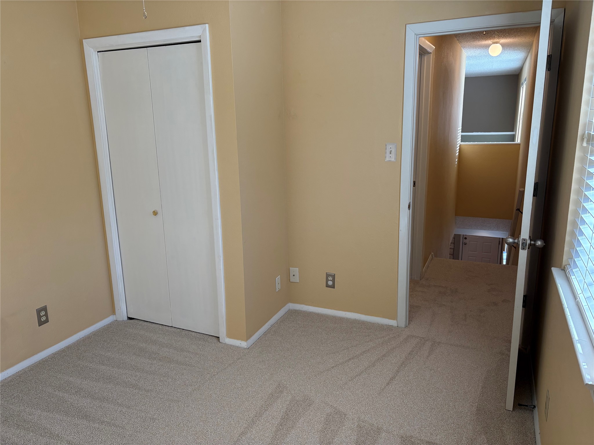 9226 Jollyville Road, Unit 144 Austin, TX 78759 - Photo 16 of 40 Unfurnished bedroom featuring carpet flooring and a closet
