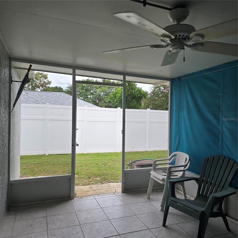 7280 Pinehurst Drive Spring Hill, FL 34606 - Photo 17 of 26 a view of an outdoor space with furniture and backyard