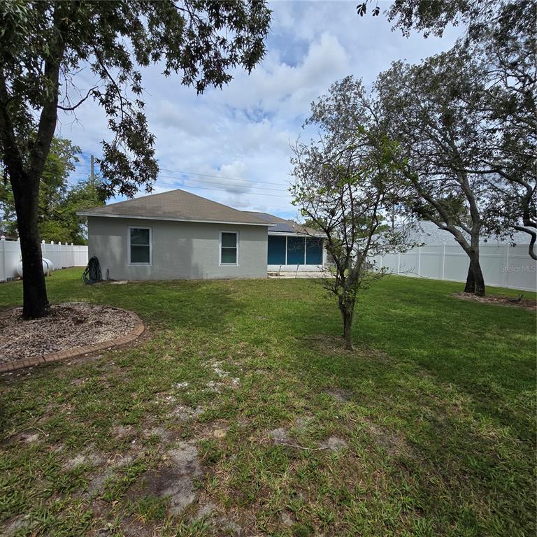 7280 Pinehurst Drive Spring Hill, FL 34606 - Photo 20 of 26 a house view with a garden space