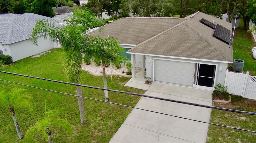 7280 Pinehurst Drive Spring Hill, FL 34606 - Photo 25 of 26 a backyard of a house with lots of green space