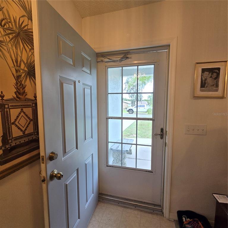 7280 Pinehurst Drive Spring Hill, FL 34606 - Photo 3 of 26 a view of an empty room with a window