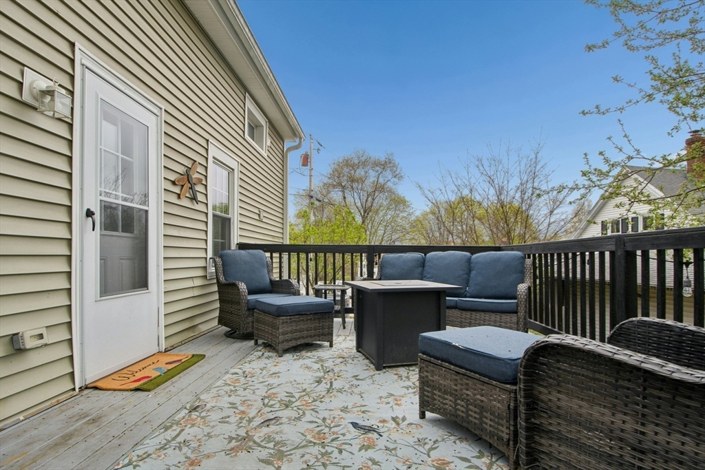 5 Elm Street Northbridge, MA 01588 - Photo 13 of 23 a balcony with furniture and wooden floor