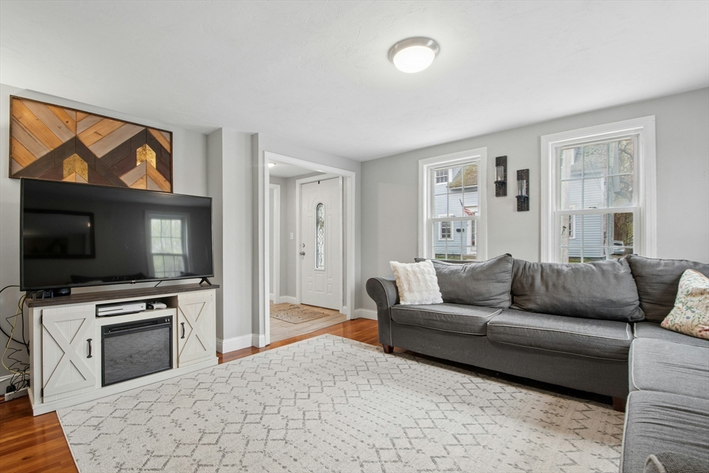 5 Elm Street Northbridge, MA 01588 - Photo 2 of 23 a living room with furniture and a flat screen tv