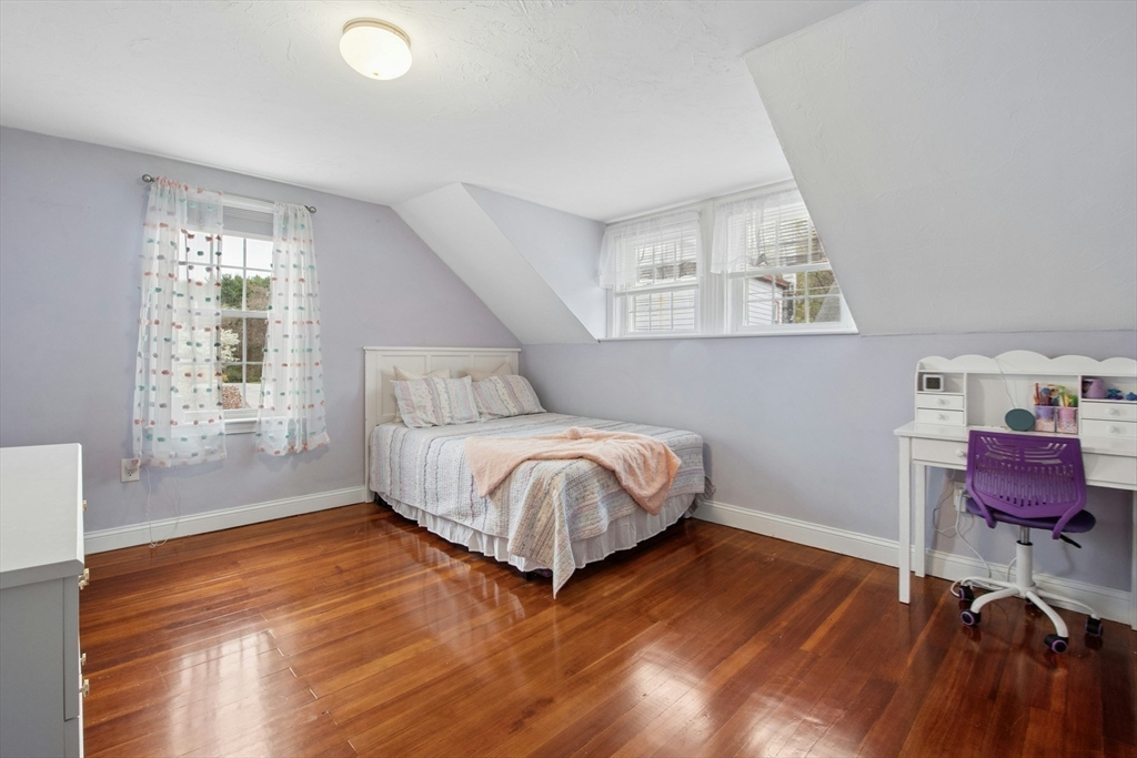5 Elm Street Northbridge, MA 01588 - Photo 10 of 23 a bedroom with a bed and a chair