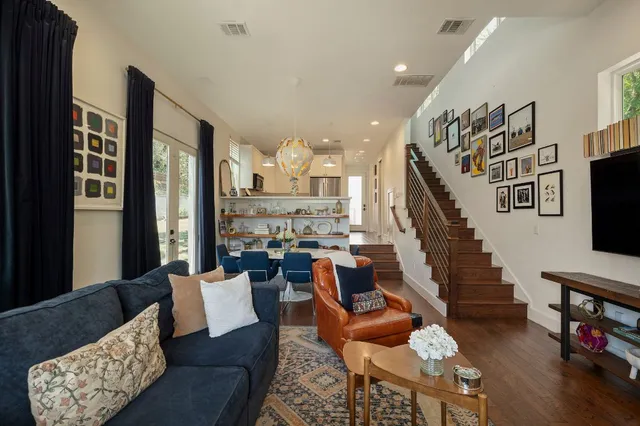 a living room with fireplace furniture and a flat screen tv