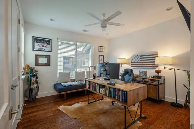 a workspace with furniture and wooden floor