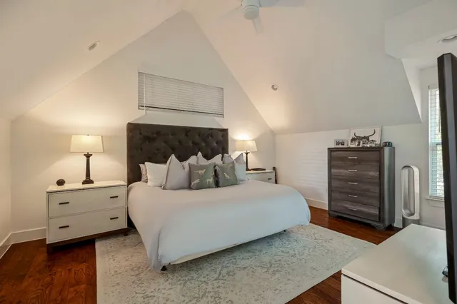 a bedroom with a bed and dresser