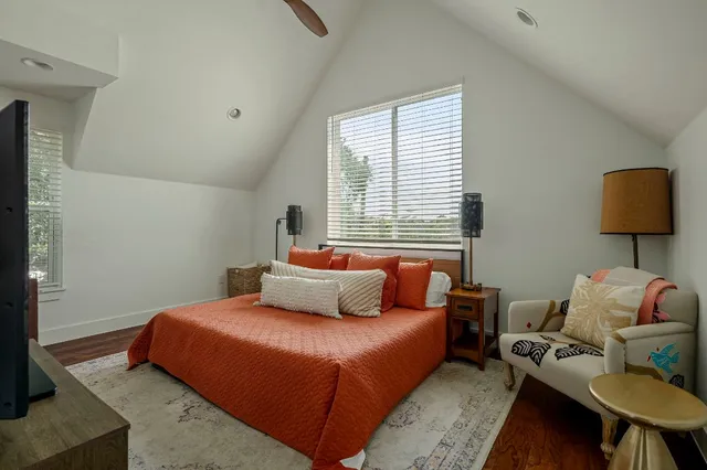 a bedroom with a bed and window