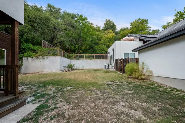 a backyard of a house with lots of green space