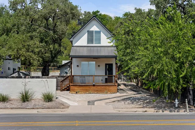 a view of a house with a sink and yard