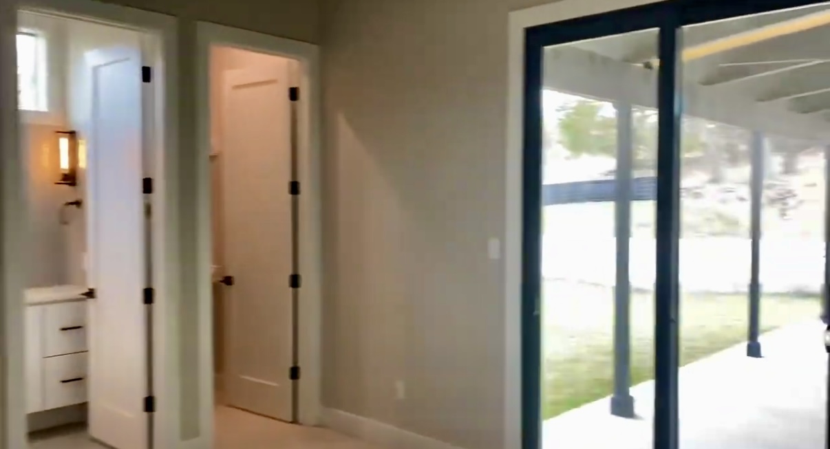 179 Shawnee Trail Dripping Springs, TX 78620 - Photo 7 of 17 a view of a bathroom with a glass door