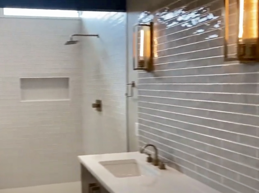 179 Shawnee Trail Dripping Springs, TX 78620 - Photo 8 of 17 a bathroom with a sink and a mirror