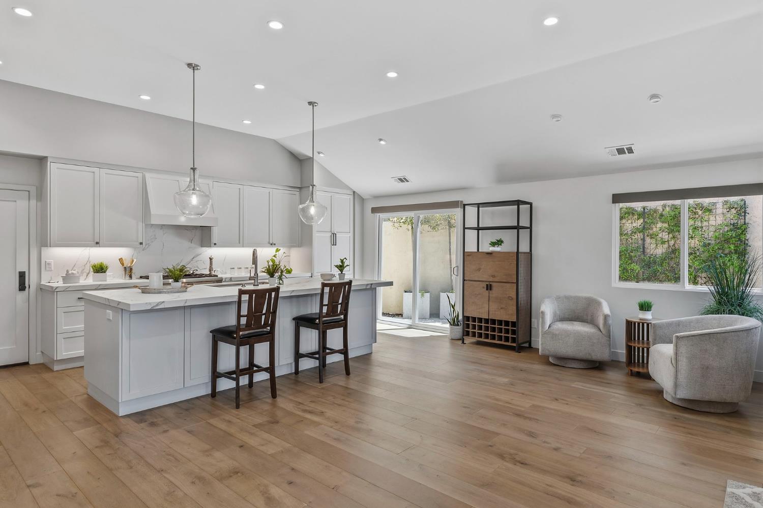 1013 Copper Lake Court Modesto, CA 95355 - Photo 29 of 66 a open dining room with kitchen island stainless steel appliances furniture a large window and a refrigerator