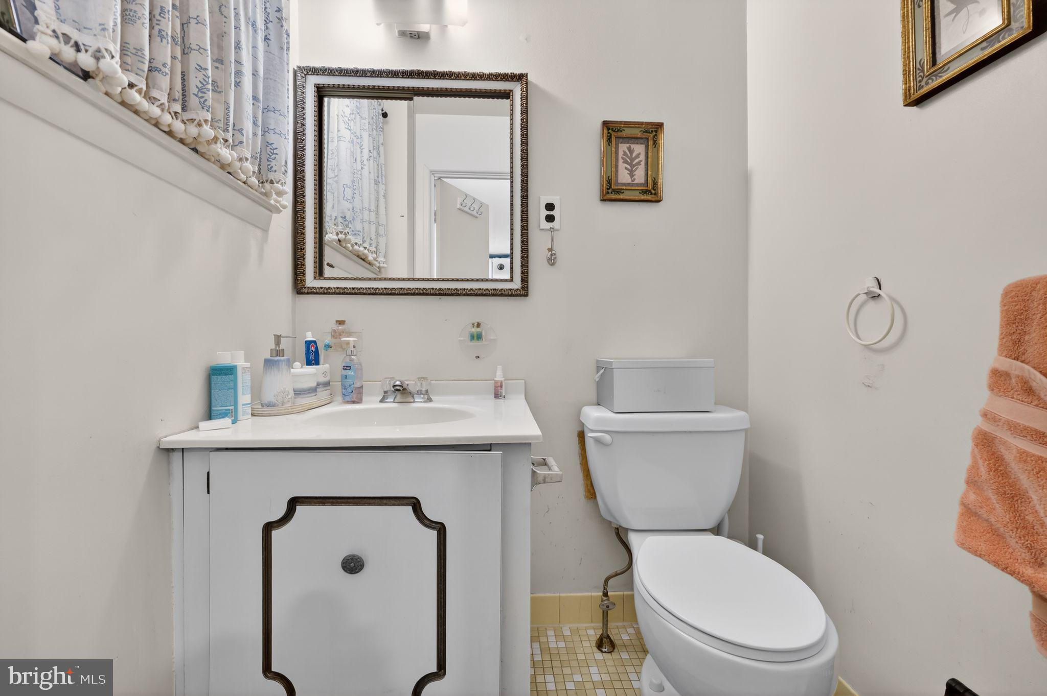 9766 Hilspach Street Philadelphia, PA 19115 - Photo 15 of 30 a bathroom with a toilet sink and mirror