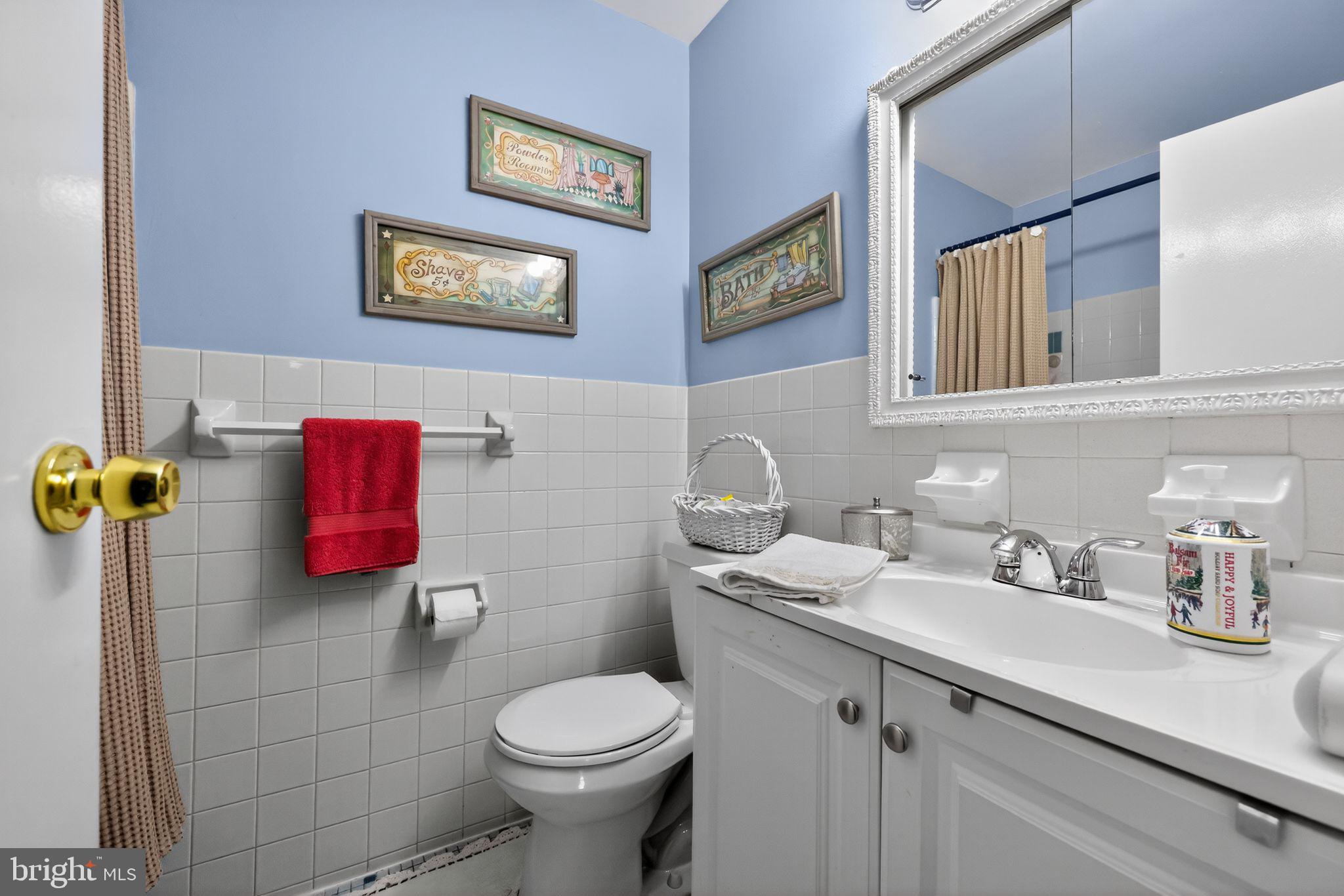 9766 Hilspach Street Philadelphia, PA 19115 - Photo 26 of 30 a bathroom with a sink mirror vanity and toilet