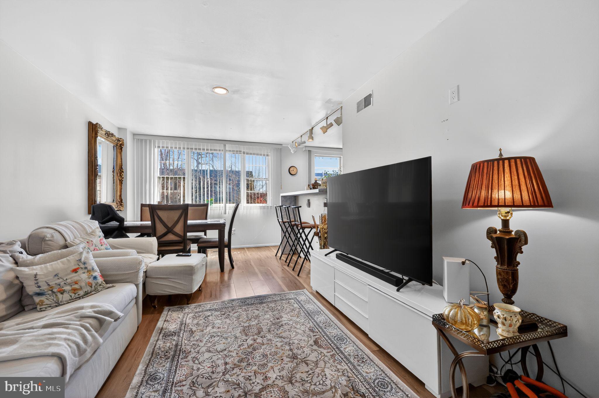 9766 Hilspach Street Philadelphia, PA 19115 - Photo 3 of 30 a living room with furniture and a flat screen tv