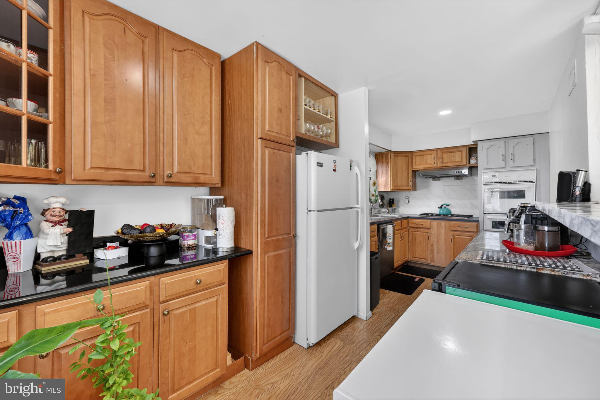 9766 Hilspach Street Philadelphia, PA 19115 - Photo 5 of 30 a kitchen with stainless steel appliances granite countertop a refrigerator and a sink