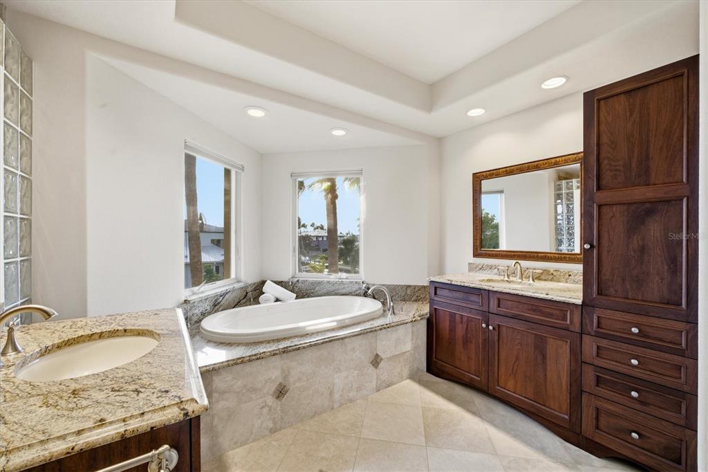 761 Norton Street Longboat Key, FL 34228 - Photo 45 of 66 a bathroom with a granite countertop sink double vanity and mirror