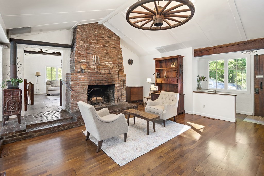 65 Old County Road Waltham, MA 02451 - Photo 6 of 42 a living room with furniture a fireplace and a large window