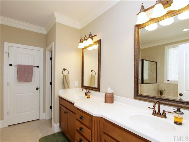 5729 Stuarts Ridge Road Wake Forest, NC 27587 - Photo 13 of 25 Master bath with walk in closet with his and her seperate sides and also two sinks. Master Bath/Spa